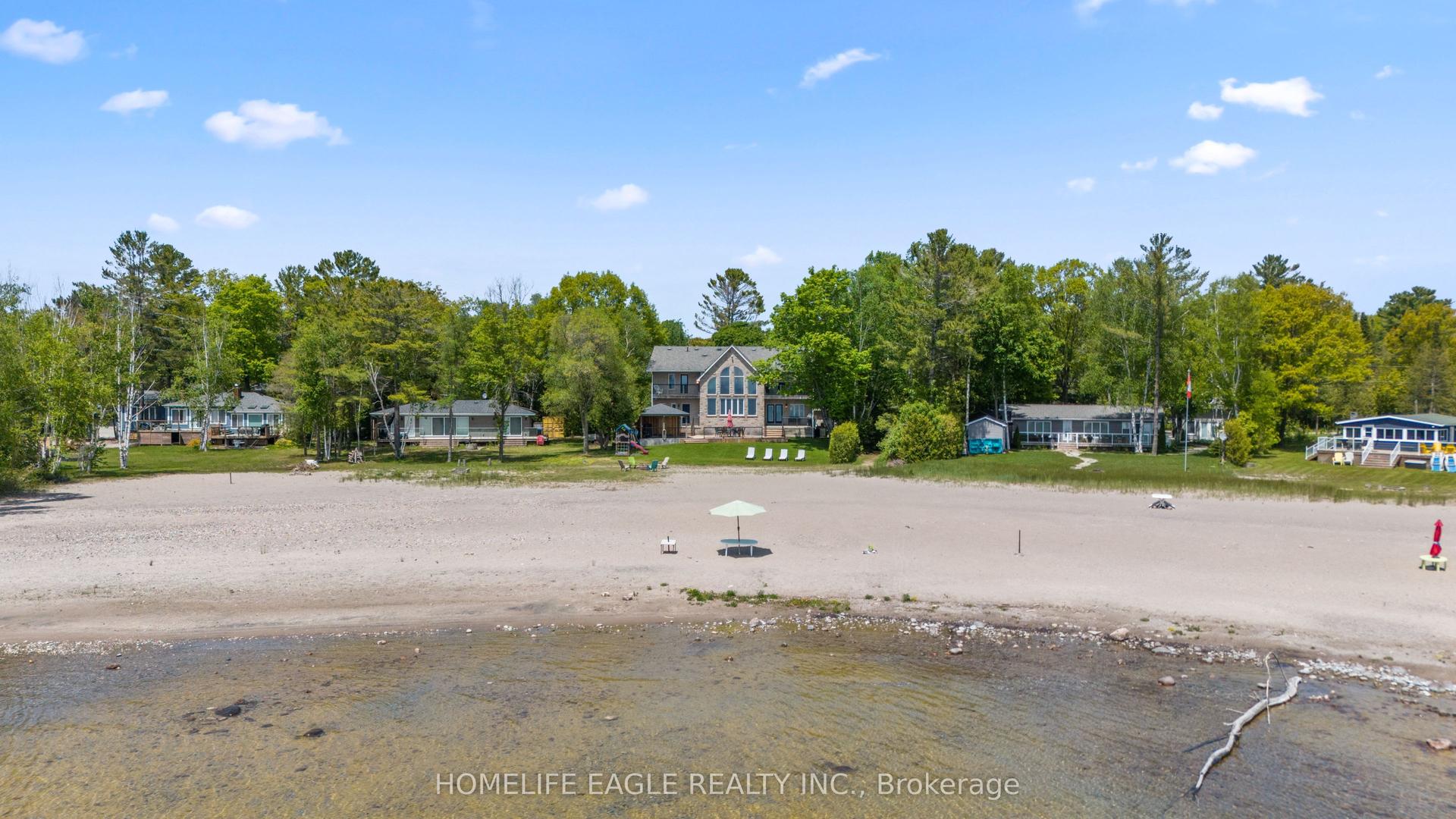 1496 Tiny Beaches Road N — photo 1